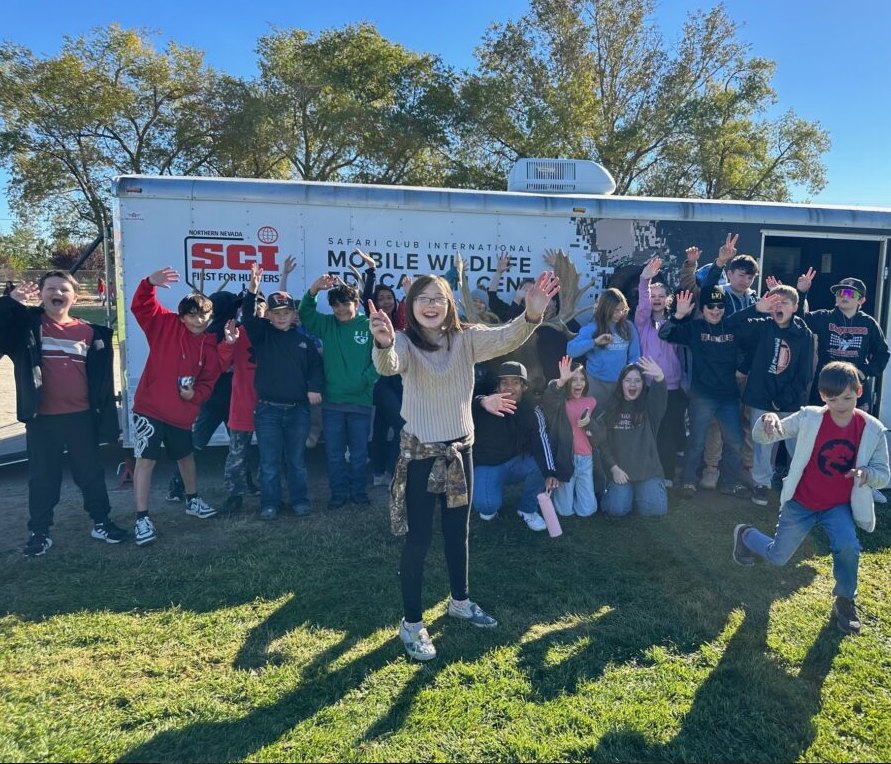 NNSCI youth group in front of the SCI Mobile Wildlife Education Center trailer